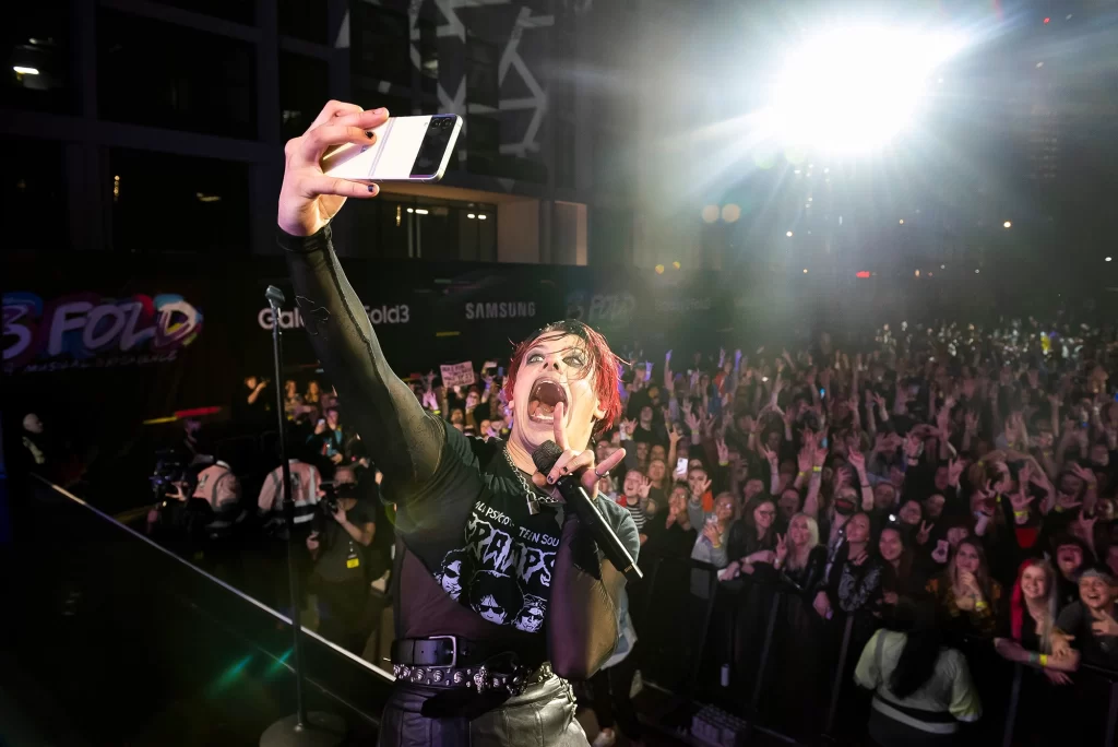 Artist taking photo at a gig after booking it using Virtual Publicist